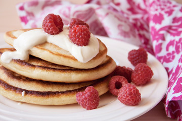 Fritters with a raspberry and sour cream