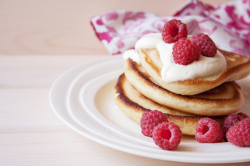 Fritters with a raspberry and sour cream