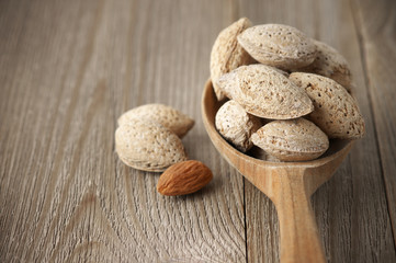 Almonds in wooden spoon