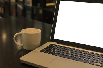 Coffee cup and laptop vintage