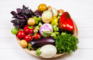 fresh vegetables on white wooden background