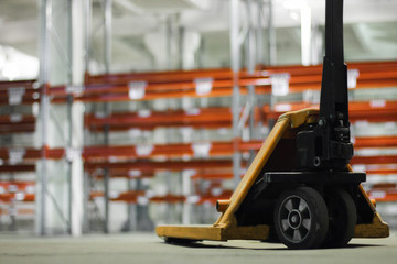 manual hydraulic lift against the light warehouse