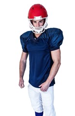 Portrait of a rugby player in blue posing