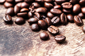 Coffee beans on grunge wooden background