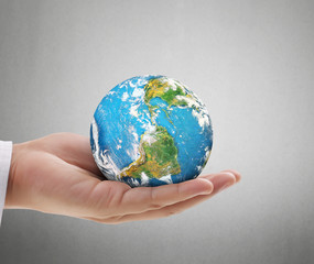 Human hand holding  globe  Elements of  image furnished by NASA