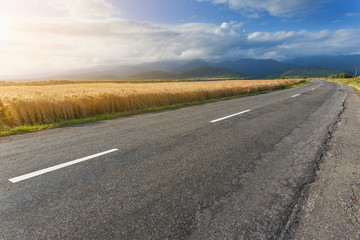 Driving on open road against the sunlight