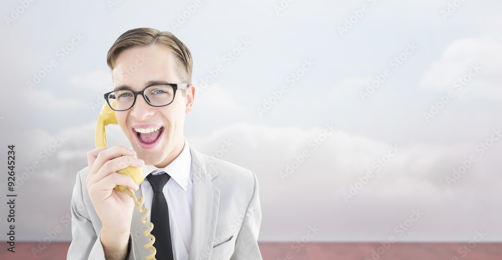 Poster composite image of geeky businessman talking on retro phone