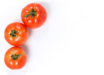 Tomatoes. Whole and  half on white