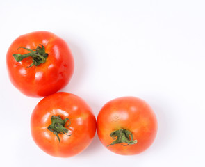 Tomatoes. Whole and  half on white