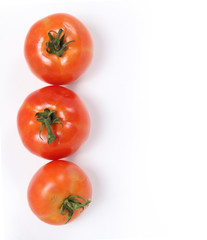 Tomatoes. Whole and  half on white