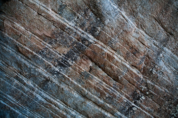 brown, black, white strips of a rock