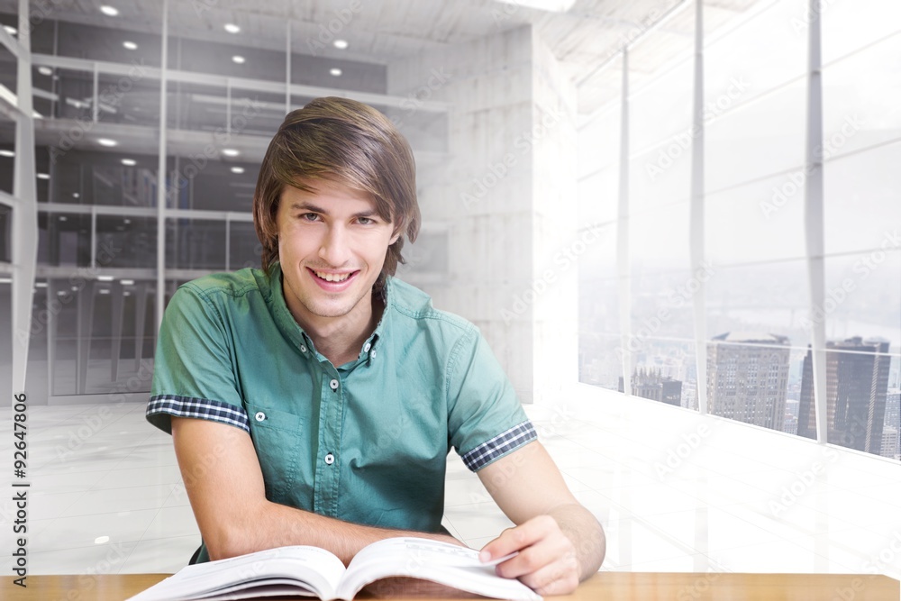 Poster composite image of student sitting in library reading