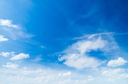 The blue sky with clouds, background