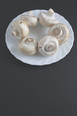 Fototapeta na wymiar Mushrooms on a white plate