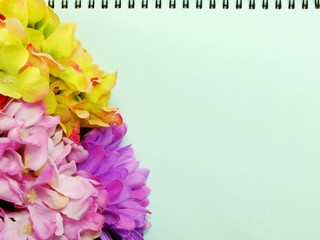 note book diary and beautiful flower bouquet background