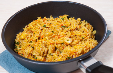 rice with mushrooms in a frying pan
