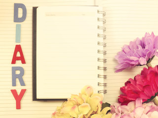 note book diary and beautiful flower bouqet with vintage filter instragram effect;