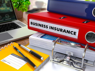 Red Ring Binder with Inscription Business Insurance.