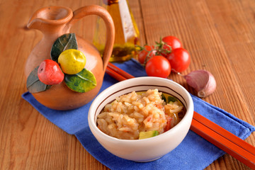 bowls of rice with cherry tomatoes and zucchini with chili oil