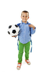 
Happy young school boy holding a football. Isolated on white background