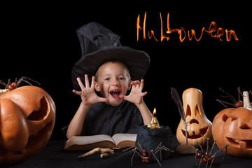 Child, Halloween pumpkin, magical things  on black background