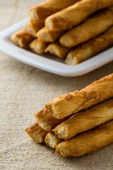 many pastry sticks with cheese