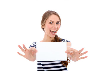 Fototapeta premium Student girl showing white blank sheet - copy space, isolated over background