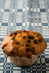 chocolate chip muffin on tablecloth