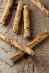pastry sticks with cheese on wooden table