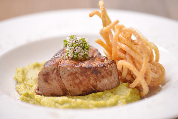 Beef steak on wooden table