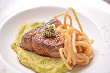 Beef steak on wooden table