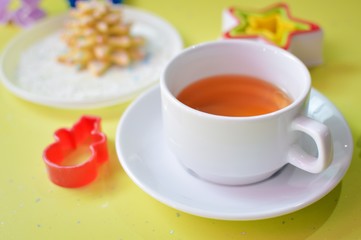 Obraz na płótnie Canvas image of tea, tasty cookies and molds