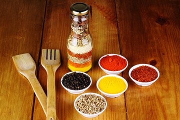 variety of spices at wood background 