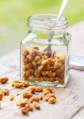 A jar of dried mulberries