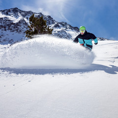 Snowboarder moving down