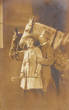 romantic couple of woman and man with horses