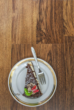 Chocolate Cake And Fork On A Saucer