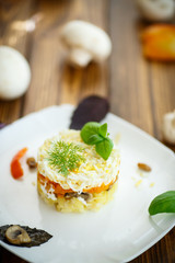 layered salad with mushrooms and vegetables