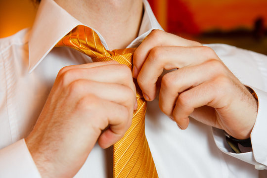 Man's Hands Put Tie Knot On Wedding Morning