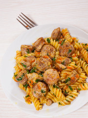 Fusilli pasta with sausage and vegetables
