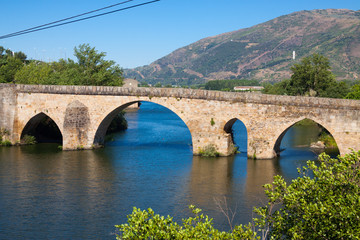 Fototapeta na wymiar View of old stone bridge in Petin