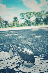 Sun glasses with reflection and road