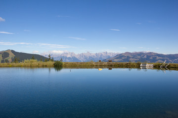 Water Reservoir On Schmittenhöhe In Zell Am See With View To Steinernes Meer & Hochkönig