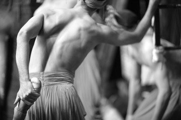 Male ballet dancer warming up backstage