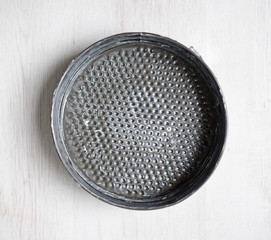 a round backing mold is greased with margarine