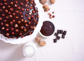 Delicious chocolate cakes with hazelnut on table close-up