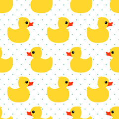 Cute seamless pattern with yellow rubber duck on polka dots background. Duck toy baby shower illustration.