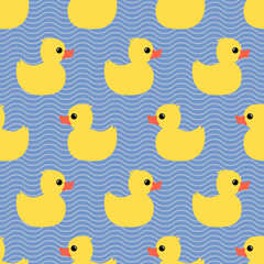 Cute seamless pattern with yellow rubber duck on wave background. Duck toy baby shower illustration.