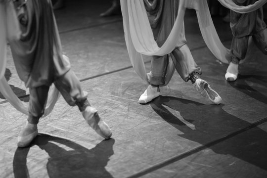 Oriental-style ballet, feet of dancing ballerinas
