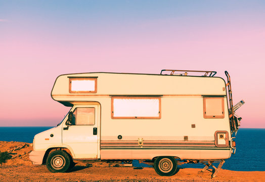 Camper on the seashore at sunset